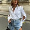 Camisas blancas elegantes para mujer
