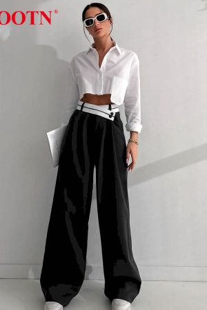 Pantalones holgados plisados negros elegantes