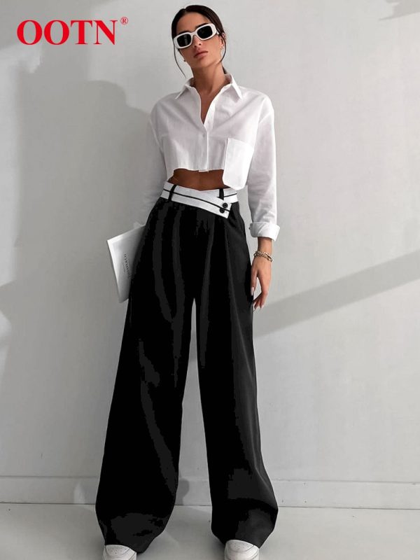 Pantalones holgados plisados negros elegantes