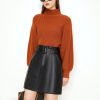 Suéteres minimalistas para mujer
